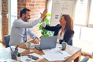 high 5 between two business partners